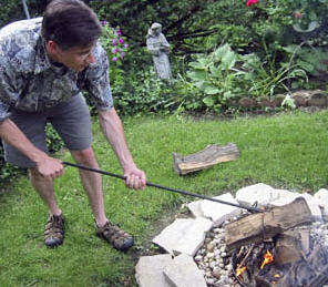 Using a Klinker Dinker Log grabber on a fire pit